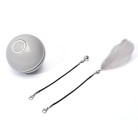White and black self-rotating cat toy with an orange ball on a flexible rod, showing motion blur. - Image 19