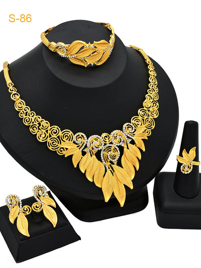 Women's Saudi bridal four-piece gold-colored jewelry set with floral and leaf designs, featuring a necklace, bracelet, earrings, and ring. - Image 15