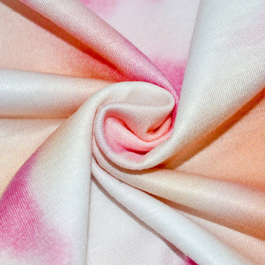 Woman wearing a pink and white tie-dye long-sleeve top and matching pants set, posing casually. - Image 9