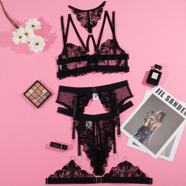 Black mesh and lace lingerie set with embroidered details, including a strappy bra, thong, garter belt, and leg garters. - Image 6