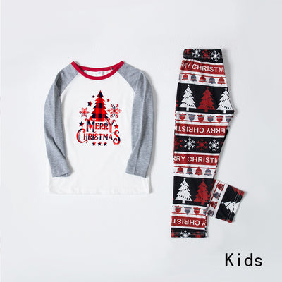 Family of four wearing matching Christmas pajamas with 'MERRY Christmas' text, leopard print, and plaid trees. - Image 8