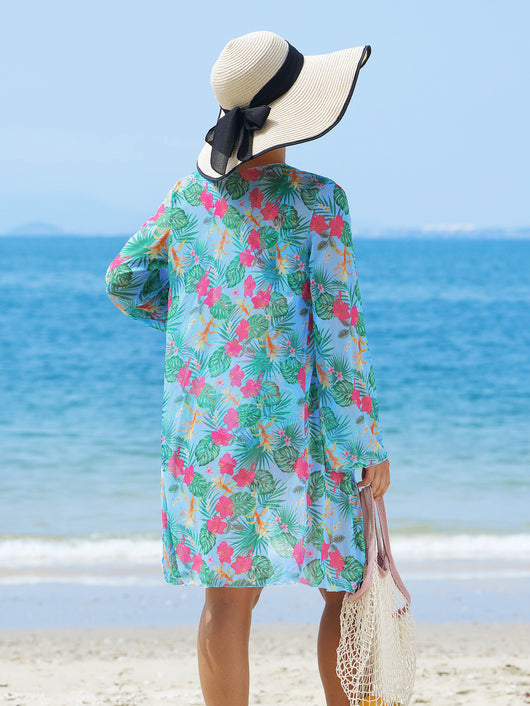 Multicolor tropical print three-piece swimsuit set with high-waisted bikini and sheer mesh cover-up on a beach. - Image 9