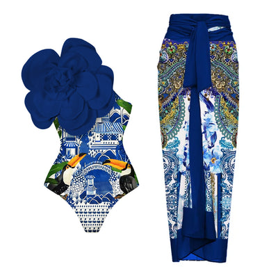 Black one-piece swimsuit with a large 3D flower on one shoulder and a geometric pattern on the bodice. - Image 8