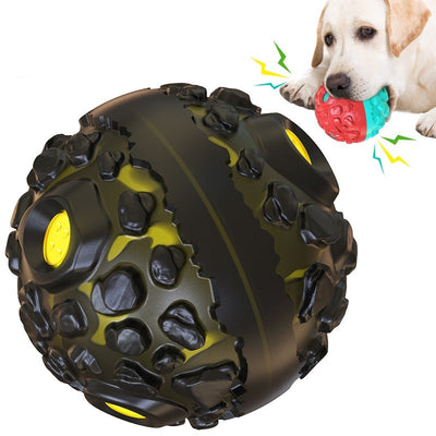 Black and yellow meteorite-shaped dog teether ball toy with textured surface and embedded yellow lights. - Image 10