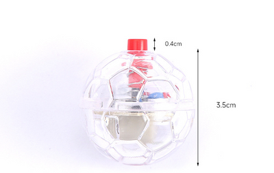 Transparent plastic pet toy ball with an internal bell and red flashing light, packaged on a pink card. - Image 6