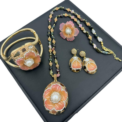 Gold-toned dangle earrings with oval drops, featuring a carved pink flower, clear rhinestones, and multi-colored tourmaline. - Image 5