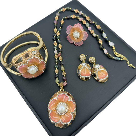 Gold-toned dangle earrings with oval drops, featuring a carved pink flower, clear rhinestones, and multi-colored tourmaline. - Image 5
