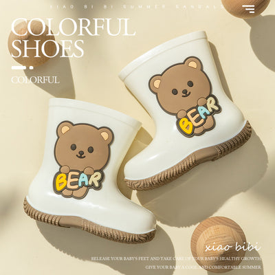 White children's rain boots with a brown cartoon bear holding colorful 'BEAR' lettering and a white fleece lining. - Image 2