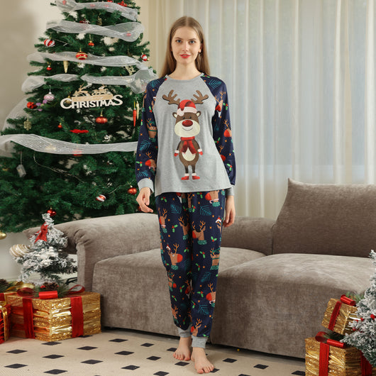 Family Christmas pajamas with a cartoon reindeer wearing a Santa hat and red scarf on a black top, and dark blue pants with a repeating reindeer and holly patte - Image 13