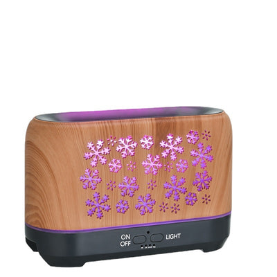 Wood grain humidifier with snowflake pattern, emitting blue flame-like mist, shown with remote control and other color options. - Image 9