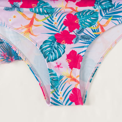 Multicolor tropical print three-piece swimsuit set with high-waisted bikini and sheer mesh cover-up on a beach. - Image 30