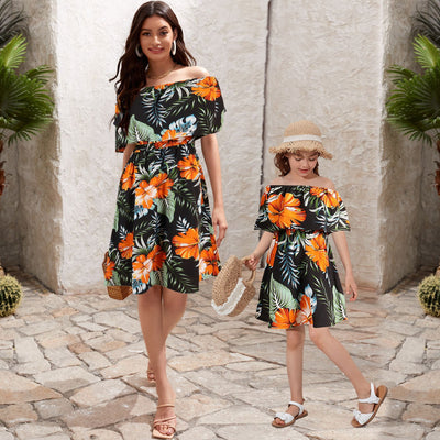 Family matching Hawaiian outfits: men's shirt and shorts, women's off-shoulder maxi dress, girl's dress, boy's shirt and shorts, all with black, orange hibiscus - Image 15