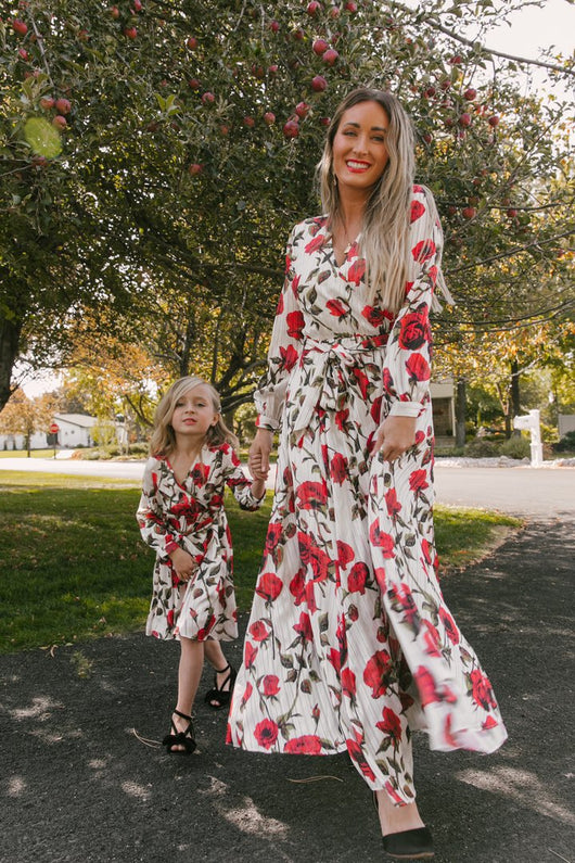 Mother and daughter in matching white dresses with red floral print, V-neck, long sleeves, and tie-waist. - Image 11