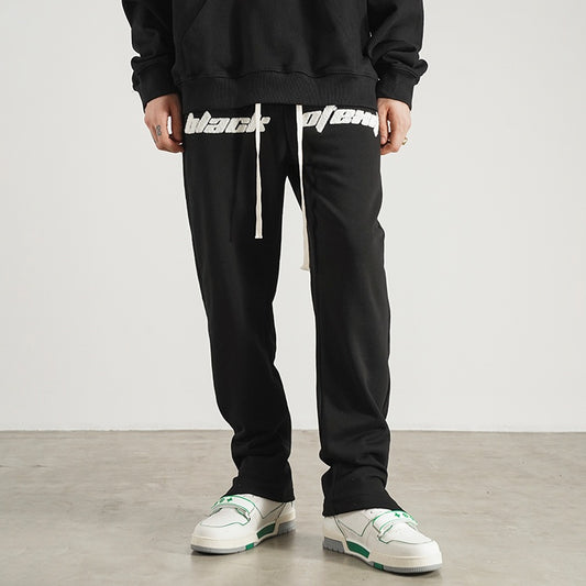 Pantalones de Buzo con Aberturas Laterales y Cordón Ajustable