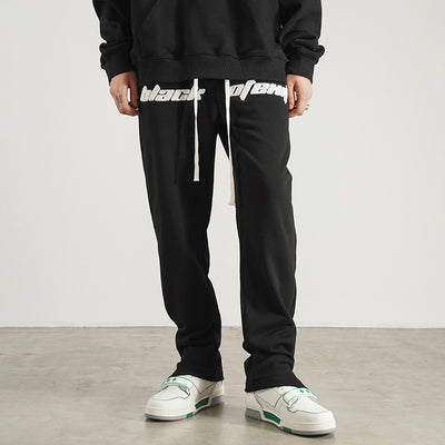Pantalones de Buzo con Aberturas Laterales y Cordón Ajustable
