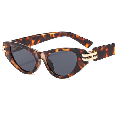 Black cat-eye sunglasses with dark gray lenses and gold-tone hinge accents on a white background. - Image 3
