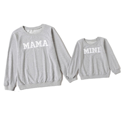 White long-sleeve adult sweater with "MAMA" text and matching child's sweater with "MINI" text. - Image 7