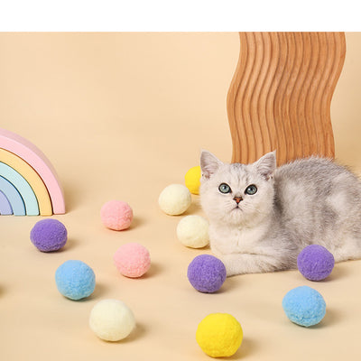 Five colorful plush balls in a white gift box, including pink, yellow, blue, purple, and bright yellow. - Image 7