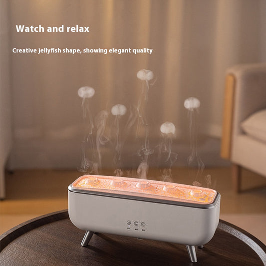 White rectangular ultrasonic humidifier with a textured top, silver legs, and control icons for mist, rotation, and light. - Image 2