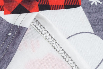 Family of five wearing matching gray and red buffalo plaid Christmas pajamas with polar bear print. - Image 18