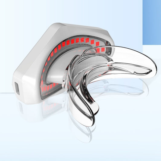 White and clear plastic beauty lip care instrument with red light elements for at-home lip treatment.