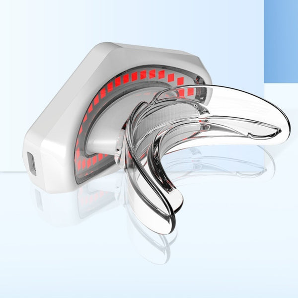 White and clear plastic beauty lip care instrument with red light elements for at-home lip treatment.