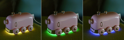 Pink retro mini train ultrasonic humidifier and aroma diffuser with rose gold accents on a white background. - Image 12