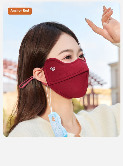Woman wearing a grey outdoor cycling wind mask with ear hooks and a small heart logo, designed for cold-proof eye protection. - Image 22