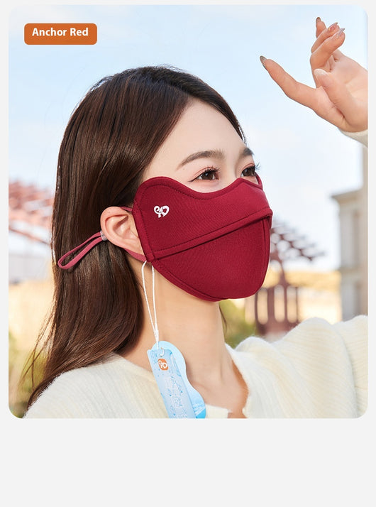 Woman wearing a grey outdoor cycling wind mask with ear hooks and a small heart logo, designed for cold-proof eye protection. - Image 22