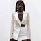 Conjunto Elegante de Blazer y Falda con Detalles Beige Bordados