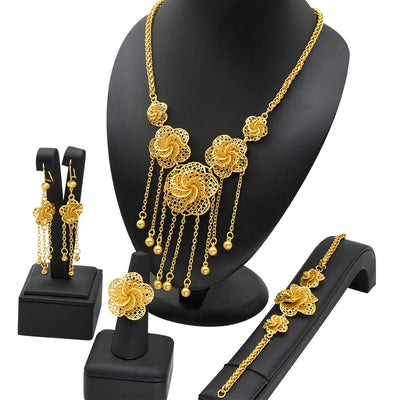 Gold-plated jewelry set with filigree flower designs, including a necklace with dangling chains, matching earrings, a ring, and a bracelet. - Image 4