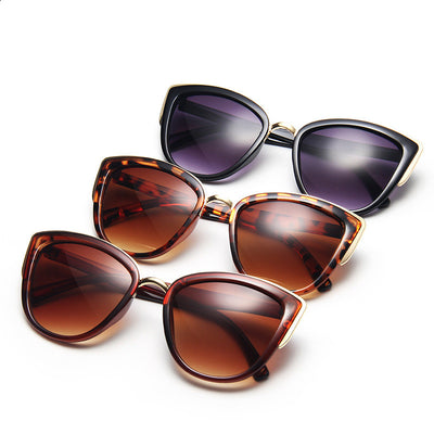 Ladies retro cat eye sunglasses with a tortoiseshell frame, gold accents, and brown gradient lenses. - Image 14