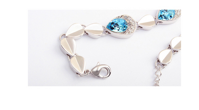 Pink teardrop crystal jewelry set with silver-tone necklace, bracelet, and stud earrings, accented with clear stones. - Image 7