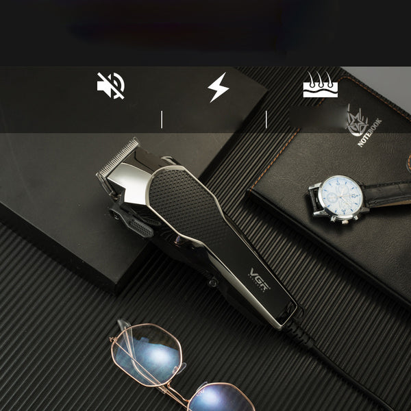 VGR V-130 professional hair clipper set with silver and black clipper, four guide combs, scissors, comb, and oil.