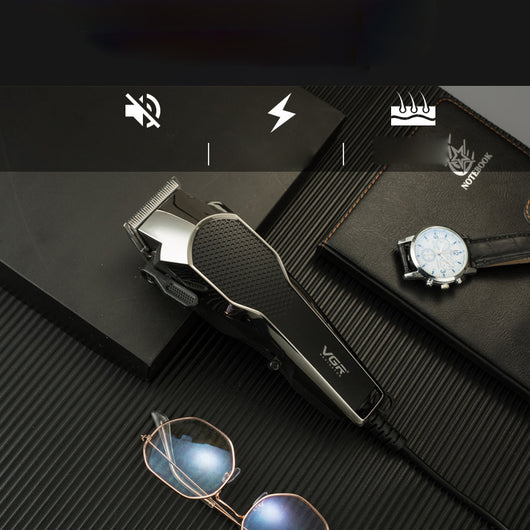 VGR V-130 professional hair clipper set with silver and black clipper, four guide combs, scissors, comb, and oil.