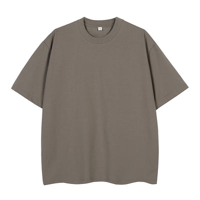 Moss green short-sleeve cotton t-shirt with a crew neck and a relaxed, oversized fit. - Image 9