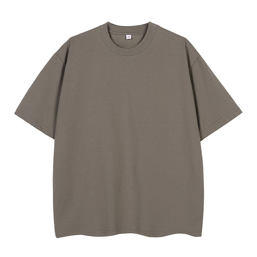 Moss green short-sleeve cotton t-shirt with a crew neck and a relaxed, oversized fit. - Image 9