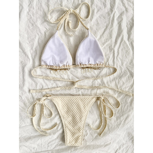 White halter lace-up bikini with a textured pattern, styled with a straw hat and gold jewelry on a sandy background. - Image 3