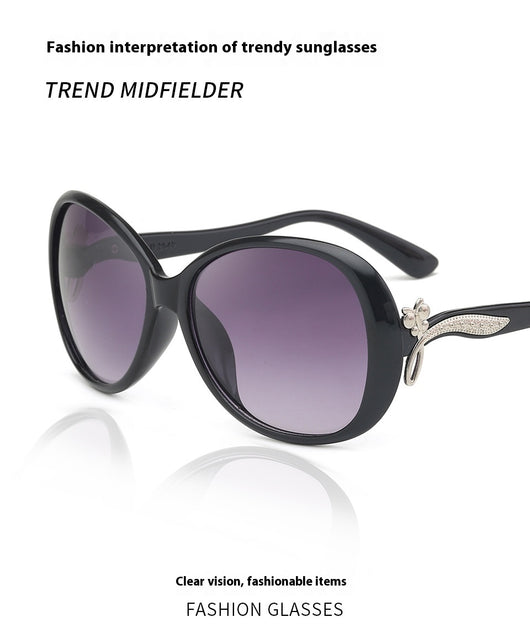 Brown oversized butterfly sunglasses with gradient lenses and a silver-tone floral accent on the temple. - Image 10