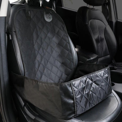 Black quilted pet car seat cover installed on a front passenger seat, protecting the upholstery. - Image 9