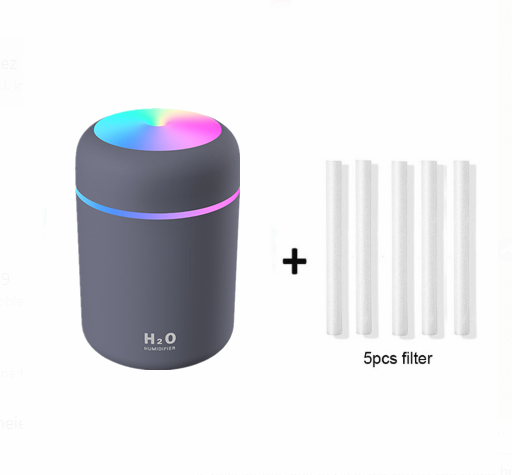 Dark gray cylindrical humidifier with colorful LED top light and thin light band, shown with five white filter sticks. - Image 4