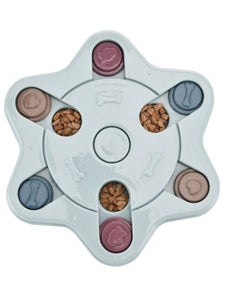 Paw-shaped dog puzzle feeder toy in light yellow with colorful sliding covers, filled with kibble. - Image 23