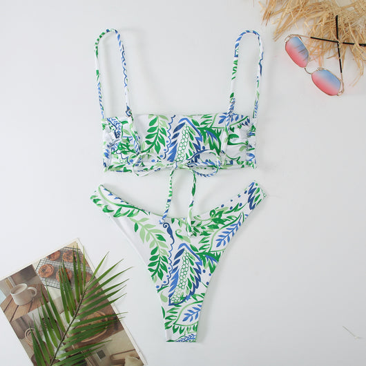 White ribbed two-piece swimsuit with pink and blue paisley floral print, bandeau top, and high-cut bottoms. - Image 12