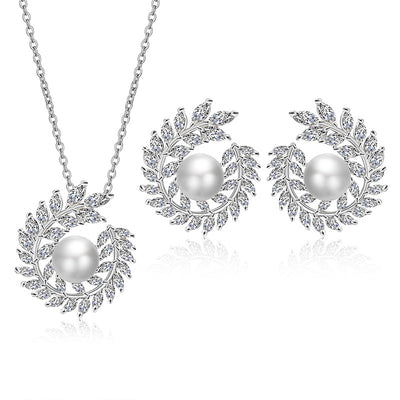 Elegant pearl and cubic zirconia jewelry set with a necklace and two earrings, featuring a wreath design. - Image 14