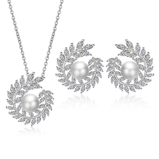 Elegant pearl and cubic zirconia jewelry set with a necklace and two earrings, featuring a wreath design. - Image 14