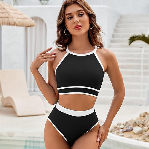 Women's black and white high-neck halter bikini swimsuit with high-waisted bottoms, featuring white trim.