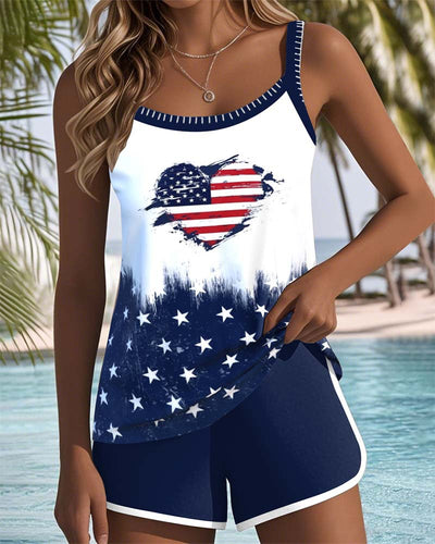 Women's grey floral print tankini swimsuit with square neckline and matching solid grey swim shorts with white trim. - Image 16