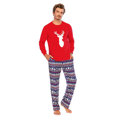 Family of five wearing matching red and navy blue Christmas pajamas with reindeer tops and fair isle pants. - Image 4