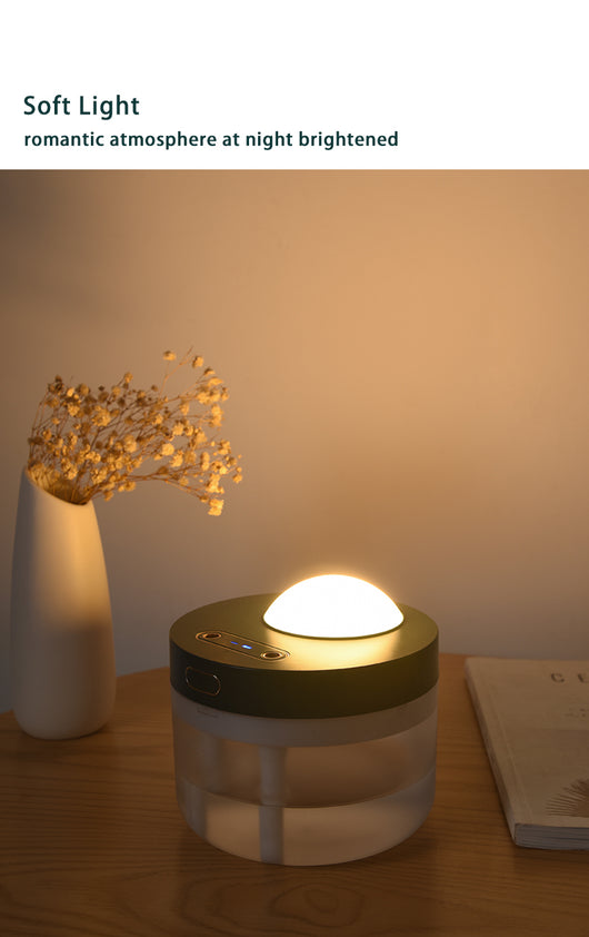 White portable projection humidifier with a translucent water tank and gold-accented control buttons. - Image 20