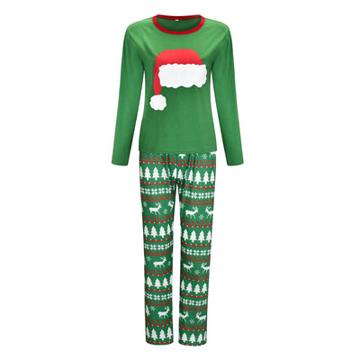 Green Christmas family pajama sets with Santa hat graphic tops and pants featuring reindeer, trees, and snowflakes. - Image 8